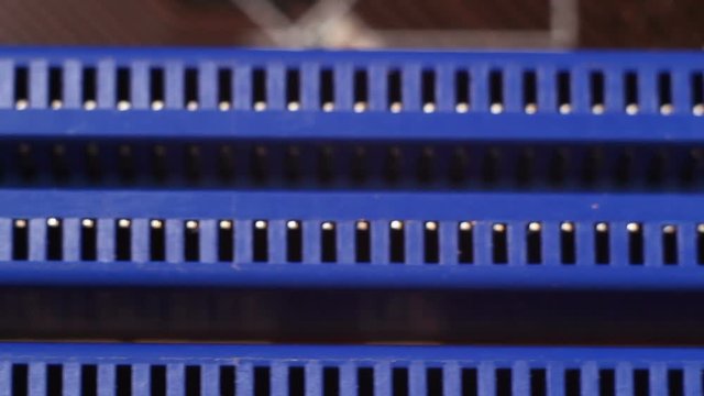 Ram soket on motherboard, selective focus with shallow depth of field. Electronic technology background.
