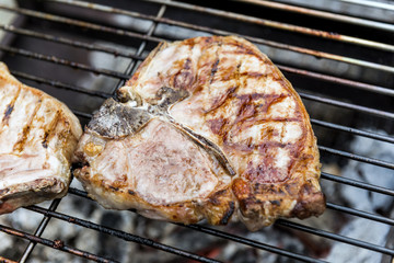 T-bone chop of pork on the grill