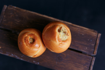cake on wooden box on black background