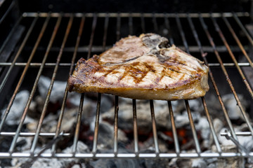 T-bone chop of pork on the grill