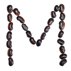 The letter M is made of beans. Symbol of the English alphabet of beans on a white background.