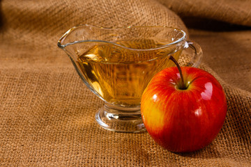 apple vinegar on a wooden rustic background
