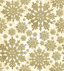 seamless background from gold snowflakes