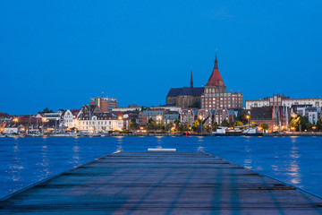 Fototapeta premium Rostock. Night Panorama view to Rostock in Germany. River Warnow and City port.