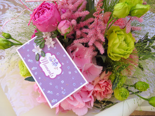 Summer bouquet with a romantic card - close-up.