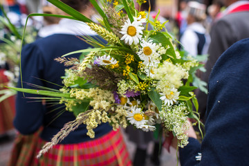 Song and dance festival in Latvia. Procession in Riga. Elements of ornaments and flowers. Latvia 100 years.