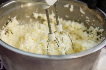 the mixer stirs the cottage cheese