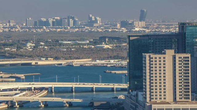Aerial skyline of Abu Dhabi city centre from above timelapse