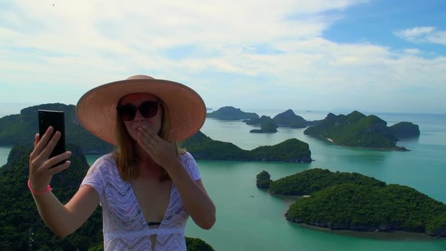 Female Traveler Taking Selfie with Tropical Islands at Angthong National Marine Park in Thailand