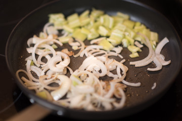 Grilled vegetables green pepper and onion in a cast iron grilling pan