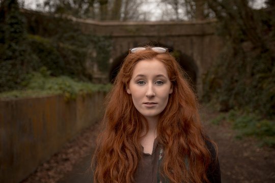 Woman standing on a countryside road