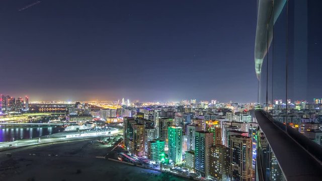 Aerial skyline of Abu Dhabi city centre from above night timelapse
