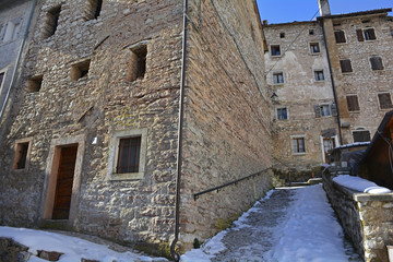 A street in the hill village of Casso in winter Friuli Venezia Giulia, north east Italy. 