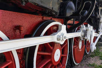 Fragment of outgoing locomotive on rails close-up from below