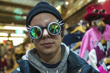 Teenager boy with a Gothic sunglasses with diffracted lens