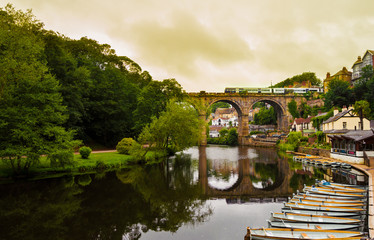 View of the Nidd River and rowing boats from the ruins of Knaresborough Castle with the train...