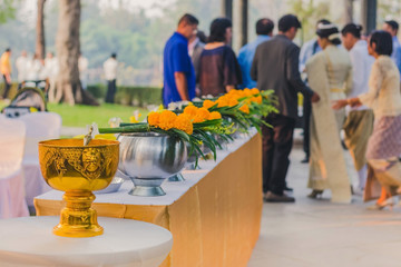 To make merit by offering food to monk ceremony in Thai wedding