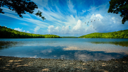 The Clinton Reservoir in West Milford, NJ on a sunny summer day - obrazy, fototapety, plakaty