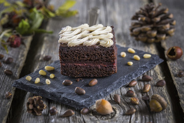 Vegan pie Black Forest with a background of cones