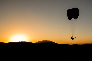 Paraglider at the sun set