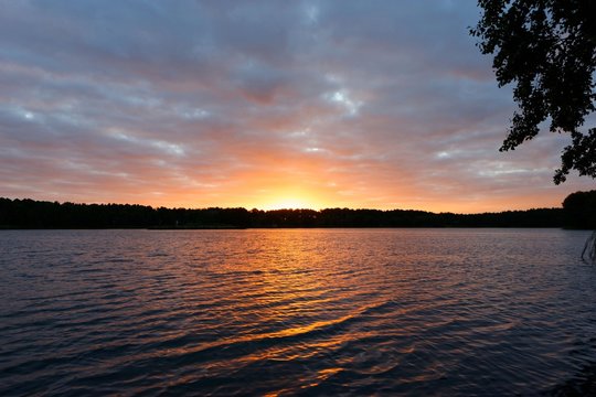 Fototapeta View on a lake during sunrise