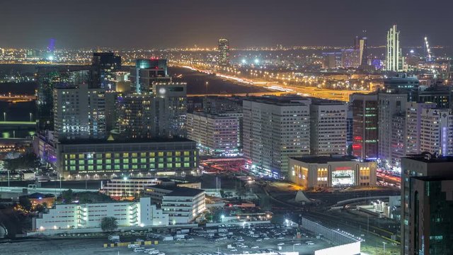 Aerial skyline of Abu Dhabi city centre from above night timelapse