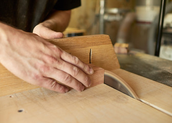 Cutting the blanks on the tailblock. Lautner makes a classic guitar.
