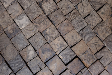 Old wooden paving on the floor. City square in the old town. Background texture