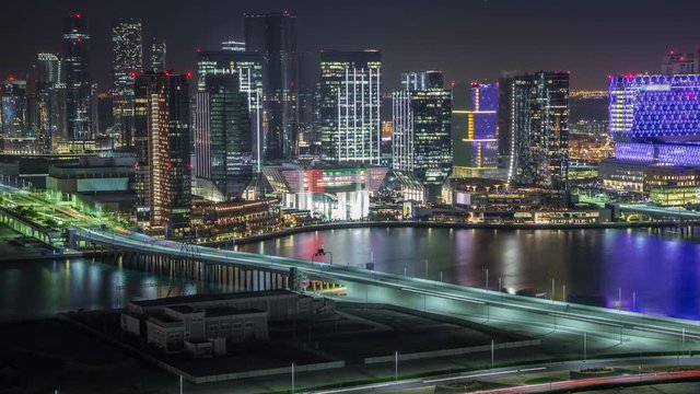 Aerial skyline of Abu Dhabi city centre from above night timelapse