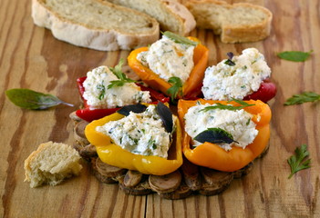 Baked paprika stuffed with cottage cheese with herbs