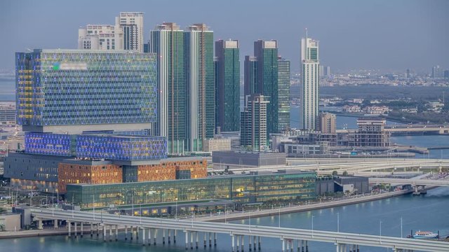 Aerial skyline of Abu Dhabi city centre from above day to night timelapse
