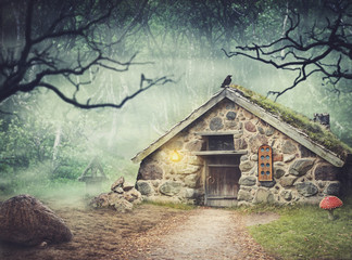 Fairy old stone house in fantasy forest with fog