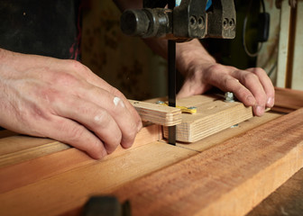 Lautner makes a classic guitar. Making slots in the lining.
