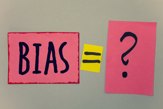 Conceptual hand writing showing Bias. Business photo text Unfair Subjective One-sidedness Preconception Inequality Bigotry Paper equal sign question marks beige background doubt message.