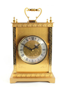 Highly Ornate Gold Clock on White Background