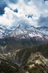 Fototapeta na wymiar Mountain peaks in snow and clouds, Nepal.