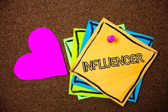 Word writing text Influencer. Business concept for Person who influences and affect decisions opinions of others Ideas messages paper pink heart cork background love lovely thoughts.