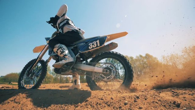 FMX racer starts moving on his motorcycle