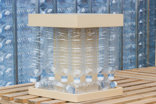 plastic bottles - concept of recycling the Empty used plastic bottle - creative chair by plastic bottles