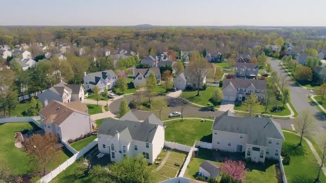 Rising Over Wooded Suburban Neighborhood with Aerial Drone