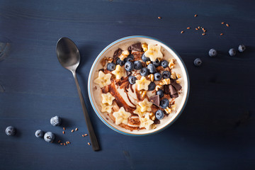 healthy banana smoothie bowl with blueberry chocolate walnuts