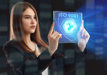 The concept of business, technology, the Internet and the network. A young entrepreneur working on a virtual screen of the future and sees the inscription: ISO 9001