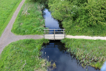 Wooden bridge over stream