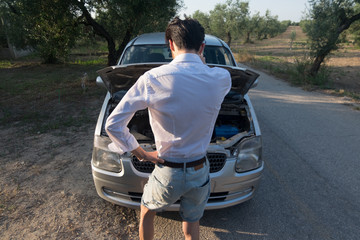 young boy, broken car