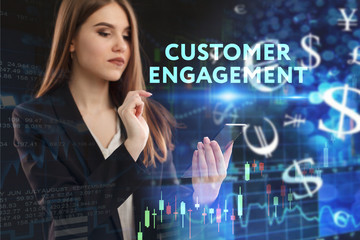 The concept of business, technology, the Internet and the network. A young entrepreneur working on a virtual screen of the future and sees the inscription: Customer engagement