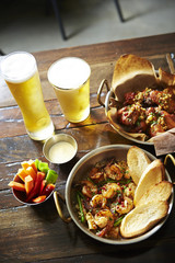 Beers with garlic shrimp and fried chicken 