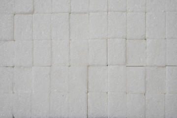 Fototapeta premium white sugar in cubes texture background