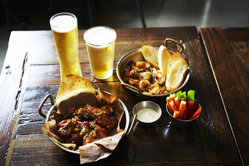 Beers with garlic shrimp and fried chicken 