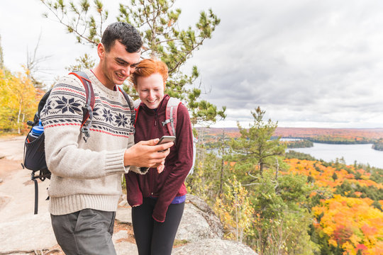Couple hiking in Ontario during colorful fall season