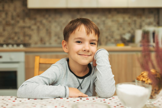 Portrait Smiling Cute Boy Looking To Camera In Warm House Atmosp